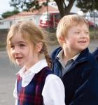 Two primary age children lining up in the playground Two primary age children lining up in the playground